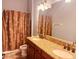 Bathroom with double vanity, granite countertop, and shower/tub at 32702 View Haven Ln, Sorrento, FL 32776