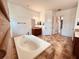 Large bathroom with a double vanity and soaking tub at 32702 View Haven Ln, Sorrento, FL 32776