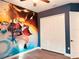 Bedroom with Naruto wall art, double doors, and wood flooring at 32702 View Haven Ln, Sorrento, FL 32776