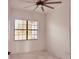Well-lit bedroom with large window and marble floors at 32702 View Haven Ln, Sorrento, FL 32776