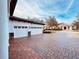 Brick paved driveway leading to a two-car garage at 32702 View Haven Ln, Sorrento, FL 32776