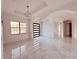 Elegant entryway featuring a modern glass front door and marble floors at 32702 View Haven Ln, Sorrento, FL 32776