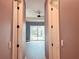 Hallway with view of the bright living area and pool at 32702 View Haven Ln, Sorrento, FL 32776