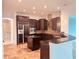 Spacious kitchen with island and dark wood cabinetry at 32702 View Haven Ln, Sorrento, FL 32776