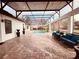 Covered patio with seating area and string lights at 32702 View Haven Ln, Sorrento, FL 32776