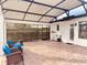 Relaxing covered patio with seating and screened enclosure at 32702 View Haven Ln, Sorrento, FL 32776