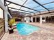 Enjoy this refreshing pool with covered patio and pavers at 32702 View Haven Ln, Sorrento, FL 32776