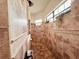 Large walk-in shower with tile surround and multiple shower heads at 32702 View Haven Ln, Sorrento, FL 32776