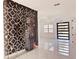 Modern glass-enclosed wine cellar with geometric pattern at 32702 View Haven Ln, Sorrento, FL 32776