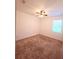 Simple bedroom with carpet, a ceiling fan, and a window providing natural light, showcasing a clean and inviting space at 4904 Blanche Ct, Saint Cloud, FL 34772