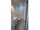 Bathroom with marble tile and light wood flooring at 1844 Coriander Dr, Poinciana, FL 34759