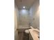 Clean bathroom with marble-style shower and tub at 1844 Coriander Dr, Poinciana, FL 34759