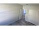 Bright bedroom with wood-look floors and closet at 1844 Coriander Dr, Poinciana, FL 34759