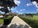 Pathway leading to community pool and amenities at 1844 Coriander Dr, Poinciana, FL 34759
