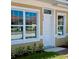 House exterior with white door and reflective windows at 1844 Coriander Dr, Poinciana, FL 34759