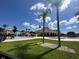 Community pool and spa with lush landscaping at 1844 Coriander Dr, Poinciana, FL 34759