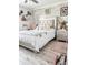 Bedroom with queen-size bed and wood-look walls at 4499 Magnolia Ridge Ct, Kissimmee, FL 34746