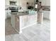 Kitchen island with modern stone countertops at 4499 Magnolia Ridge Ct, Kissimmee, FL 34746