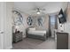 Neutral themed room with twin bed, modern decor, and ceiling fan at 7713 Graben St, Kissimmee, FL 34747