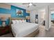 Comfortable bedroom featuring a queen-sized bed, ensuite bathroom, and stylish decor at 7713 Graben St, Kissimmee, FL 34747