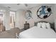 Bedroom featuring a clean design with unique sports mural and gray laminate flooring at 7713 Graben St, Kissimmee, FL 34747