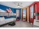 Fun themed ' room with bunk beds, cartoon wall art and colorful decor at 7713 Graben St, Kissimmee, FL 34747