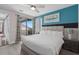 Bedroom featuring balcony access, stylish curtains, and comfortable sleeping arrangements at 7713 Graben St, Kissimmee, FL 34747