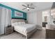 Well-lit bedroom offering a private bathroom, closet, and neutral color scheme at 7713 Graben St, Kissimmee, FL 34747