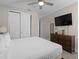Serene bedroom features neutral tones, clean lines, and a sleek modern dresser at 7713 Graben St, Kissimmee, FL 34747