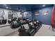 Luxury home theater room featuring plush seating, projector and movie decor at 7713 Graben St, Kissimmee, FL 34747