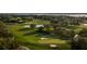 Aerial view of a luxurious golf course community with water features at 6000 Tarawood Dr, Orlando, FL 32819