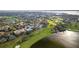 Aerial view of a neighborhood near a lake and golf course at 6000 Tarawood Dr, Orlando, FL 32819