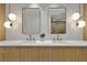 Double vanity bathroom with contemporary light fixtures at 6000 Tarawood Dr, Orlando, FL 32819