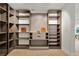 Large walk-in closet with ample shelving and drawers at 6000 Tarawood Dr, Orlando, FL 32819