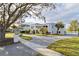 Beautiful two-story home with a circular driveway and mature landscaping at 6000 Tarawood Dr, Orlando, FL 32819