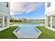 Modern, geometric pool with lake view and spacious backyard at 6000 Tarawood Dr, Orlando, FL 32819