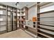 Large storage room with custom shelving and glass-front cabinets at 6000 Tarawood Dr, Orlando, FL 32819