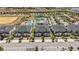 Overhead shot of a townhome community with a pool and water park in the background at 1065 Splash Shot Pl # 1801, Davenport, FL 33896