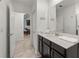 Bright bathroom featuring a modern vanity and access to the kitchen at 1065 Splash Shot Pl # 1801, Davenport, FL 33896