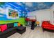 Fun bedroom featuring bunkbeds, a Mickey Mouse theme, and hardwood flooring at 1065 Splash Shot Pl # 1801, Davenport, FL 33896