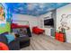Playful bedroom with custom Mickey Mouse decor, bunk beds, and a cozy seating area at 1065 Splash Shot Pl # 1801, Davenport, FL 33896