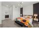 Bright bedroom features a decorative accent wall and stylish furnishings, including a plush sunflower bedspread at 1065 Splash Shot Pl # 1801, Davenport, FL 33896