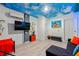 Fun bedroom features a sky ceiling, themed décor, and seating area perfect for a room at 1065 Splash Shot Pl # 1801, Davenport, FL 33896