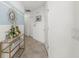 Inviting entryway features stylish decor, a console table, and tiled flooring at 1065 Splash Shot Pl # 1801, Davenport, FL 33896