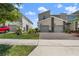 Modern townhomes showcase brick driveways and well-manicured landscaping at 1065 Splash Shot Pl # 1801, Davenport, FL 33896