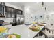 Kitchen with counter seating and stainless steel appliances and quartz countertop at 1065 Splash Shot Pl # 1801, Davenport, FL 33896