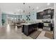 Open-concept kitchen boasts sleek black cabinets and a breakfast bar overlooking the dining area at 1065 Splash Shot Pl # 1801, Davenport, FL 33896