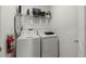 Functional laundry room with updated appliances and ample shelving at 1065 Splash Shot Pl # 1801, Davenport, FL 33896