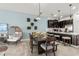 Open-concept space with a dining area and a kitchen with a breakfast bar, perfect for entertaining at 1065 Splash Shot Pl # 1801, Davenport, FL 33896