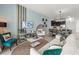 Inviting living room area with stylish decor, comfortable seating, and an open view to the kitchen at 1065 Splash Shot Pl # 1801, Davenport, FL 33896